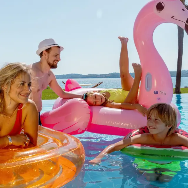 Familiy In Swimmingpool